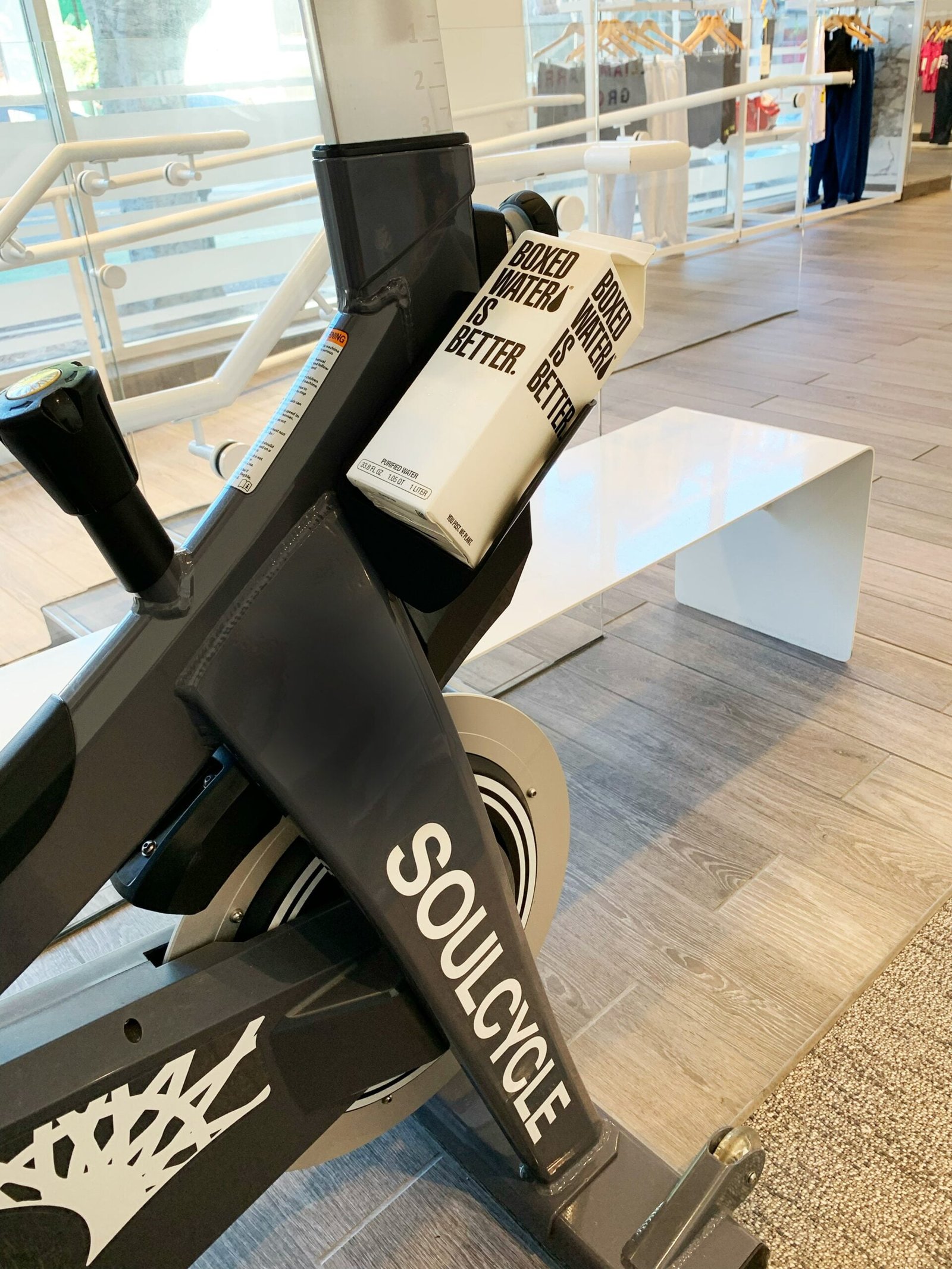 a stationary stationary bike in a building with people in the background